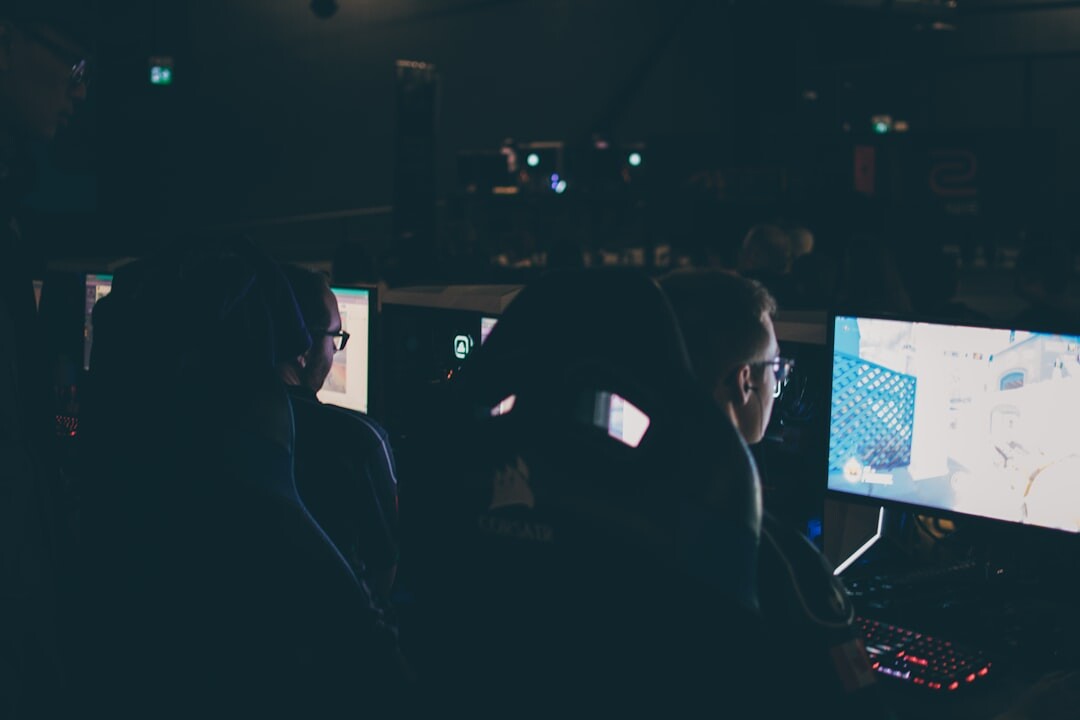Journalist monitoring several live news feeds on multiple screens