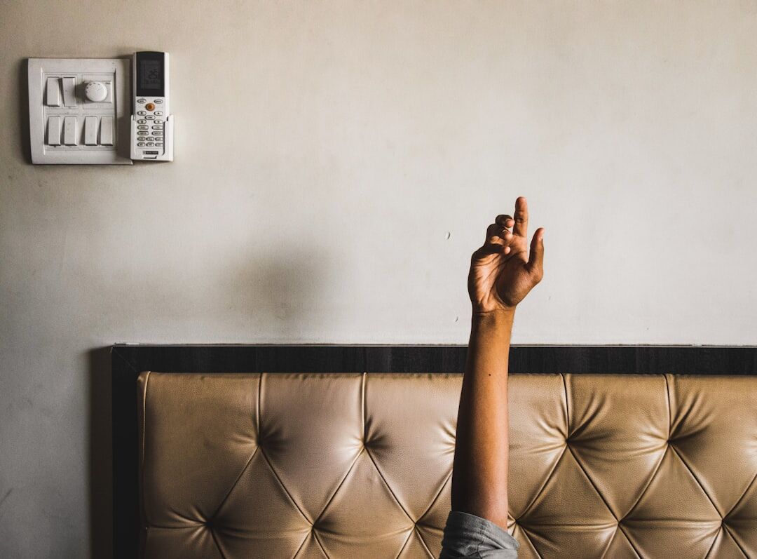 Hand pointing at an alert dashboard on a screen