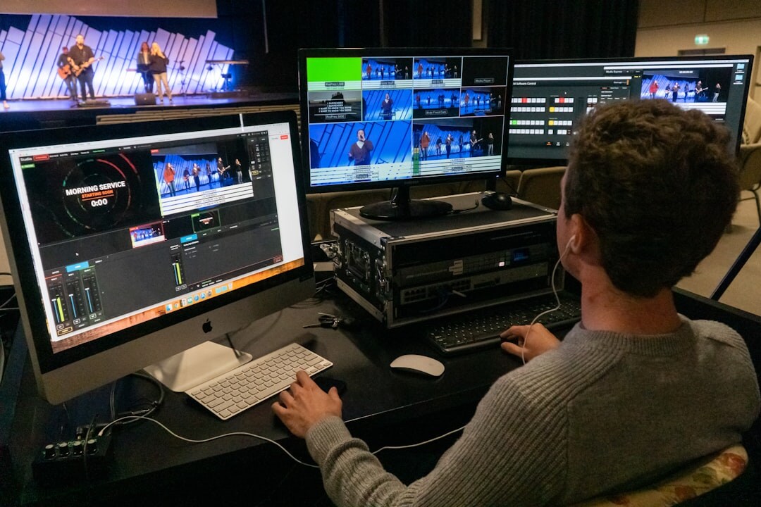 Newsroom control room with editors monitoring multiple live broadcast screens