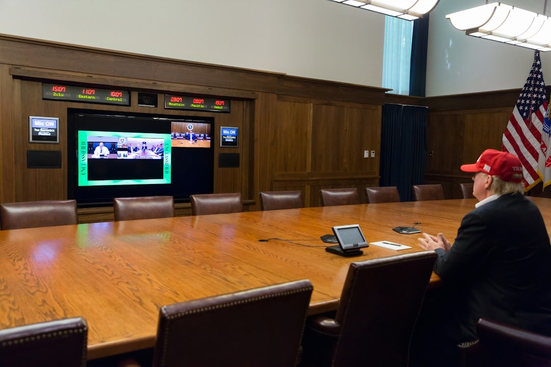 Broadcast desk with breaking news graphic displayed on a large screen